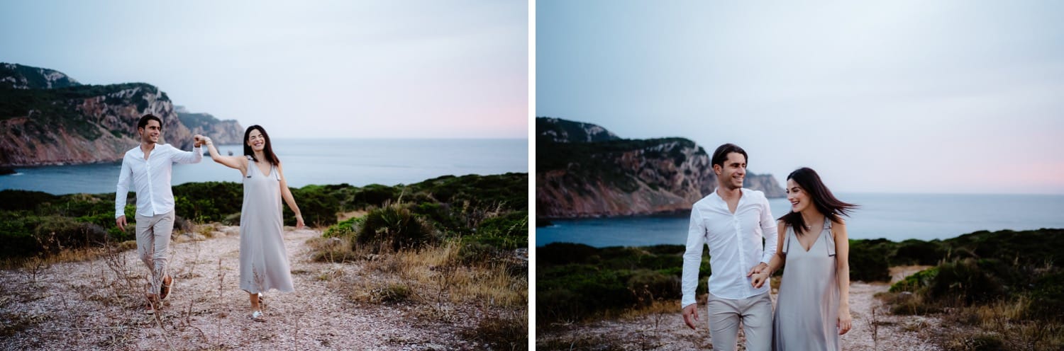 Couple walking on a rocky beach in Alghero, photographed by Valeria Mameli